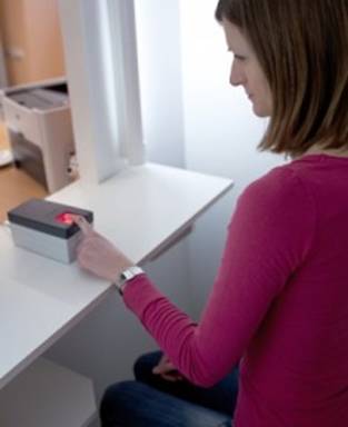 Ladys hand on biometric readers